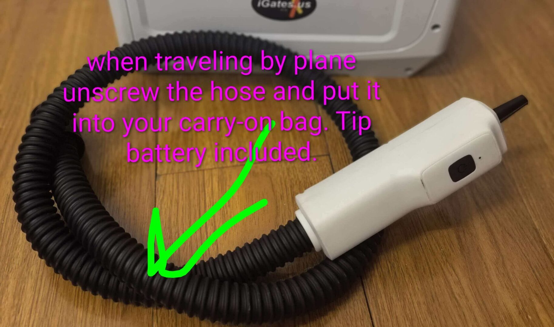 Travel-sized portable battery with hose for convenience.