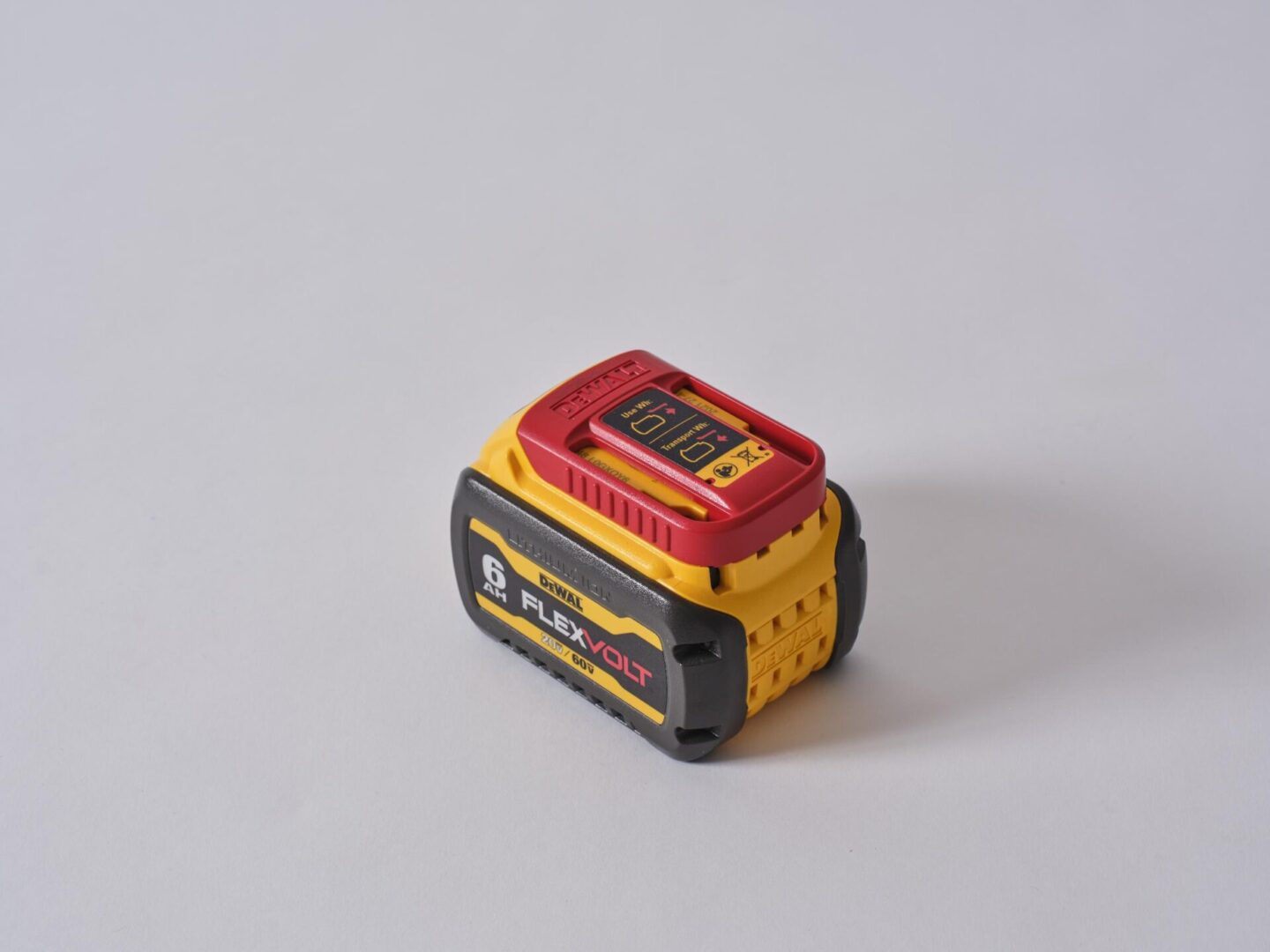 A compact DeWalt battery pack against a plain background.
