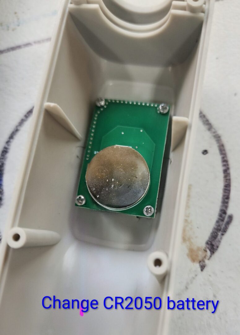 CR2050 coin cell on green circuit board
